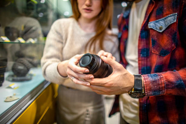 istock Young couple seen in a camera shop 1459456647