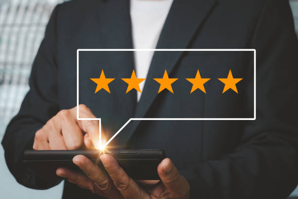 istock Hand business man analyzing the questionnaire and combining the satisfaction score with five yellow stars. 1459458699