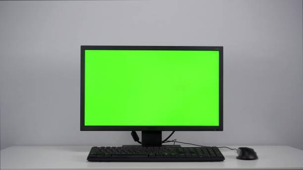 istock Green screen on a computer monitor in the office. Chroma key on pc. 1459461533