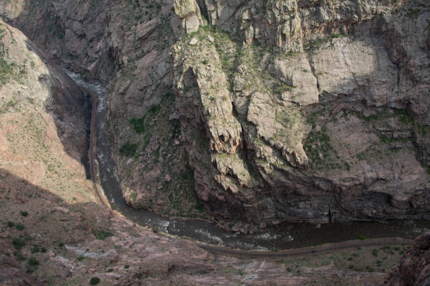 istock River winding along the bottom of a steep canyon 1459463086