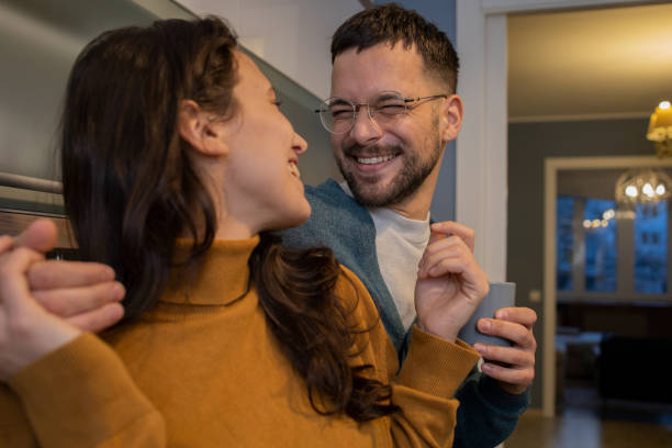 istock Happy young couple at home 1459463103