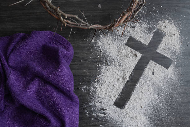 istock Ashes cross, partial crown of thorns and purple cloth 1459467202