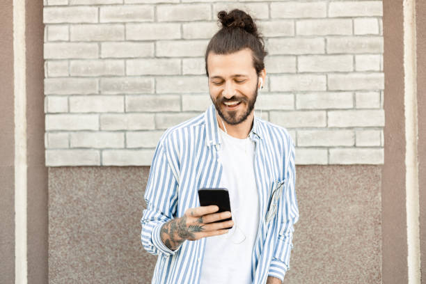 istock Young man walking and enjoying music 1459471082