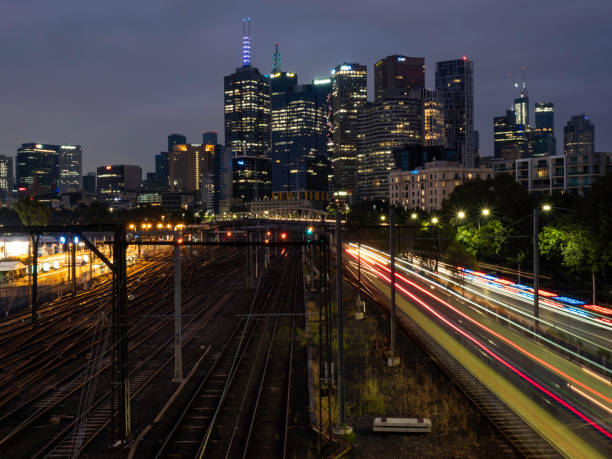 istock Urban skyline and train tracks at night 1459476768
