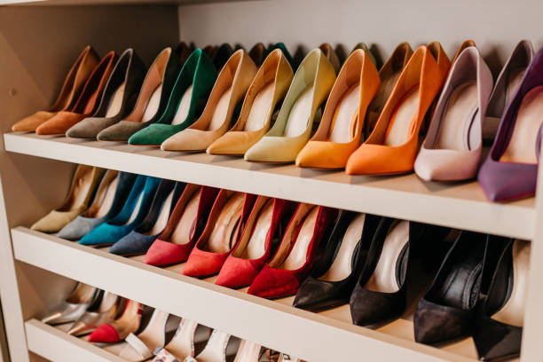 Organization - Shelves with shoes organized and lined up Organization - Shelves with shoes organized and lined up high heel shoes stock pictures, royalty-free photos & images