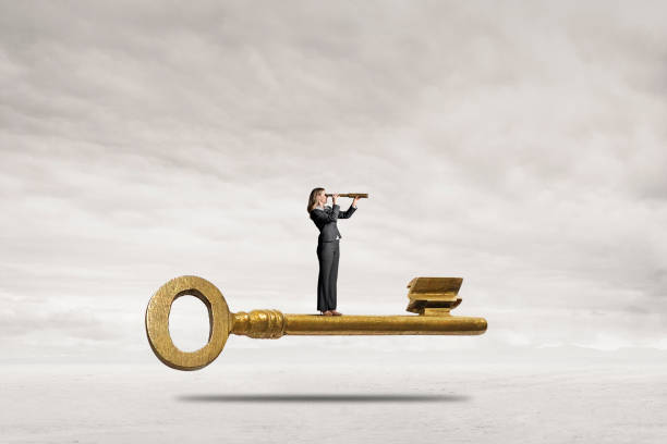 istock Woman Looking Through A Spyglass While Standing On Key 1459478439