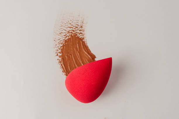 istock Makeup - Pink foundation sponge with foundation strokes 1459478712