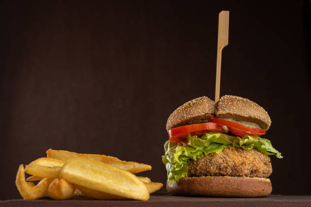 istock Hamburger - Snack with chicken burger, lettuce, tomato, mozzarella cheese and fries 1459479350