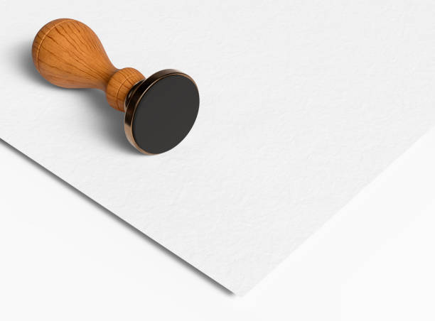 istock Bell metal head stamp tool with wooden handle on white paper 1459481529