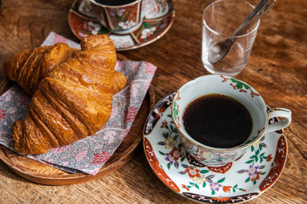 istock Hot black coffee and Croissants. 1459481699