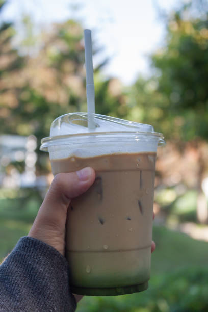 istock Woman hold her iced coffee 1459489400