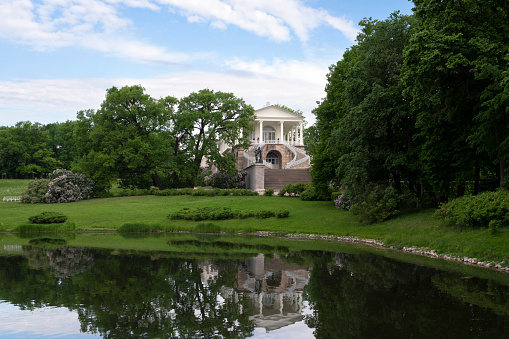 Cameron Gallery with a reflection in the Large Pond in the Catherine Park of Tsarskoye Selo on a summer day, Pushkin, Saint Petersburg, Russia