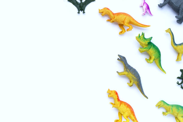 istock Plastic dinosaur toys on white background. Top view 1459494305