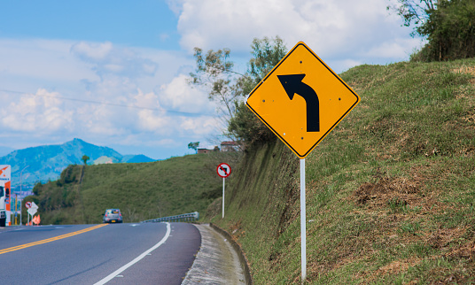image of the traffic signs for caution and care while driving on the highway