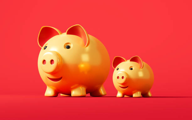 istock Gold piggy banks in the red background, 3d rendering. 1459496291