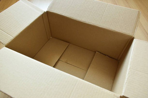 istock brown post box packaging put on wood floor 1459497818