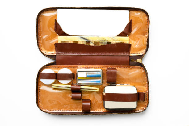 istock Opened men's travel hygiene products leather case on white background 1459498504