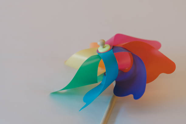 Close up of colorful toy wind turbine. Multicolor pinwheel