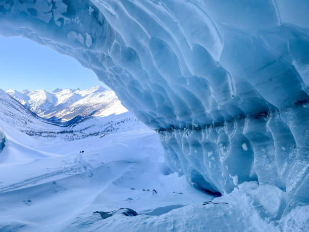 istock Ice cave in the snowcapped mountain range in Switzerland 1459502455