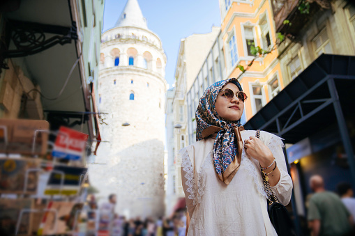 Tourist  looking at Galata tower, Istanbul, Turkey