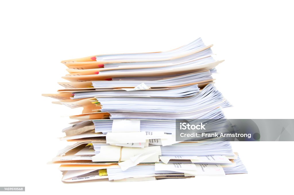 Manila folders stacked overflowing at an office on a white background Document Stock Photo