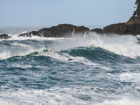 Unusual waves known as king tides near the shore at Depoe Bay, Oregon. Pacific Ocean waves look beautiful, but can be dangerous. During the king tides Depoe Bay is a very popular destination to watch nature in action.