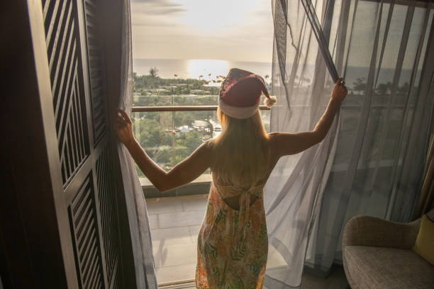 istock Woman in hotel room celebrating chritmas 1459515794