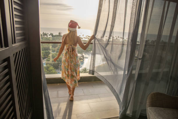 istock Woman in hotel room celebrating chritmas 1459516095