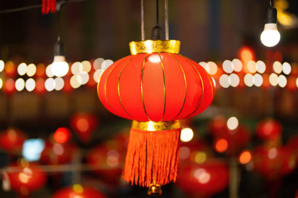 istock A strikingly large red Chinese lantern hangs on the overpass during Chinese New Year at night. Around there are lights and bokeh. to wait to celebrate the festival. 1459518014