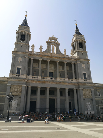 Tourists sightseeing at the Cathedral de la Almudena, the royal Cathedral  in Madrid, Spain.