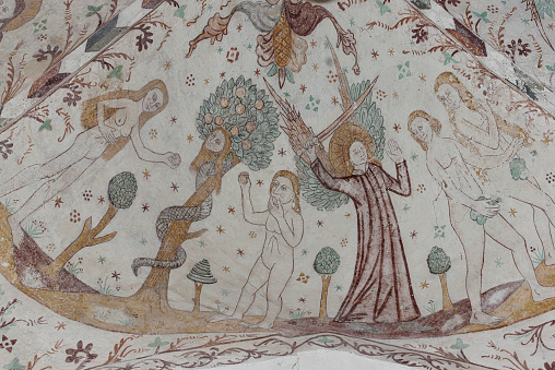 The fall of men in the Paradise, an old fresco in Elmelunde church, Denmark, October 10, 2022