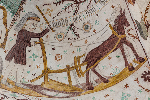 plowing with two horses, a medieval fresco in Elmelunde church, Denmark, October 10, 2022