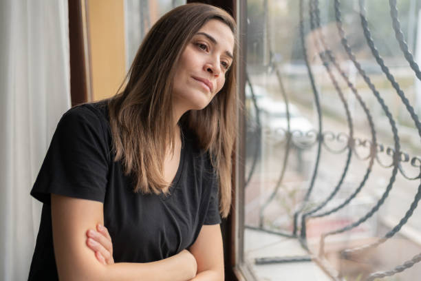 Woman Looking Out The Window
