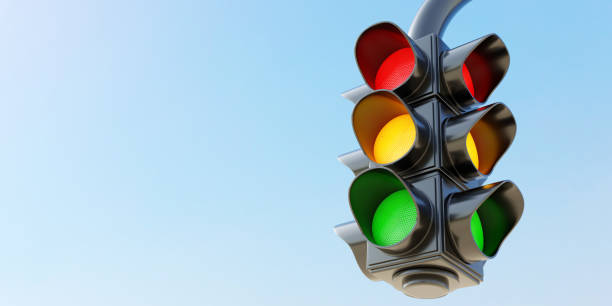 Double hanging traffic light with all three color on empty blue sky background. Space. 3d render stock photo