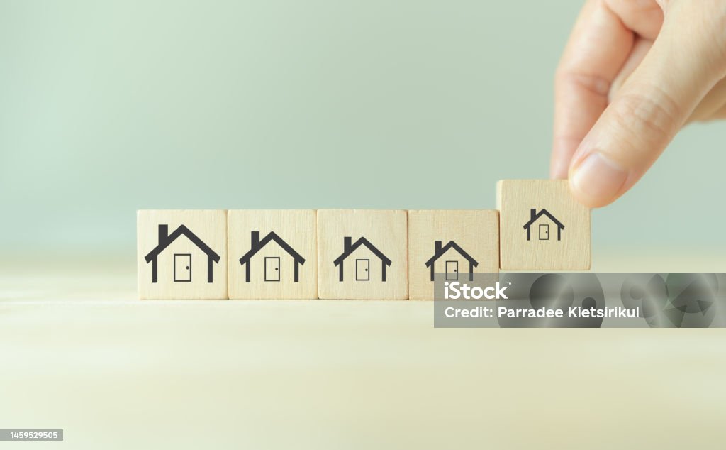Downsizing home, houses concept. Downsizing property due to retirement or budget. Finding a tiny house or apartment. Moving to a smaller property for retirement time.  Increasing cash flow. Apartment Stock Photo