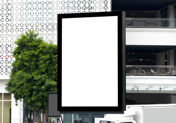 istock Outdoor pole billboard with mock up white screen on city view background and clipping path 1459540042