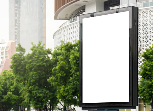 istock Outdoor pole billboard with mock up white screen on city view background and clipping path 1459540084