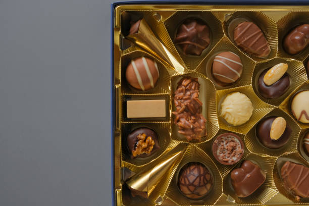 istock Assorted chocolate candies on a gray background. Chocolate box.Milk chocolate candy.Sweets and desserts.Sweets box in assortment 1459541528