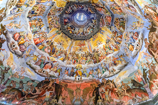 Florence, Italy - June 03, 2022: Judgment Day fresco inside the Brunelleschi dome cupola of the Duomo Cathedral or Cattedrale di Santa Maria del Fiore