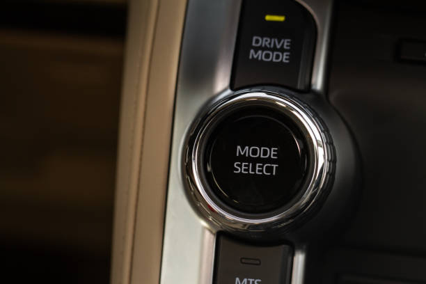 istock Drive selector button. Car interior, offroad drive controller closeup view. Wheel drive selection. Four-Wheel Drive transmission selection system. 1459545482