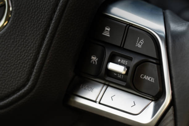 istock Cruise control switch closeup. Adaptive cruise control leaver. Cruise control on steering wheel. 1459545664