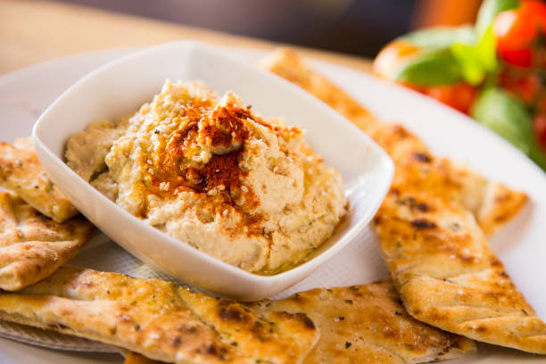 istock Hummus is a cream of chickpeas cooked with lemon juice, which includes tahini paste and olive oil, which, depending on the local variant, can also include other ingredients such as garlic or paprika. 1459545759