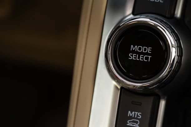 istock Drive selector button. Car interior, offroad drive controller closeup view. Wheel drive selection. Four-Wheel Drive transmission selection system. 1459545836