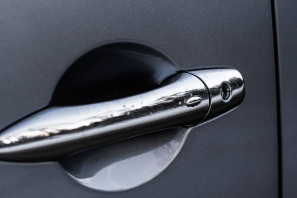 istock Close up of car door handle. Keyless entry system with touch sensor. Car remote control by smart key. 1459545908