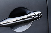 Close up of car door handle. Keyless entry system with touch sensor. Car remote control by smart key.