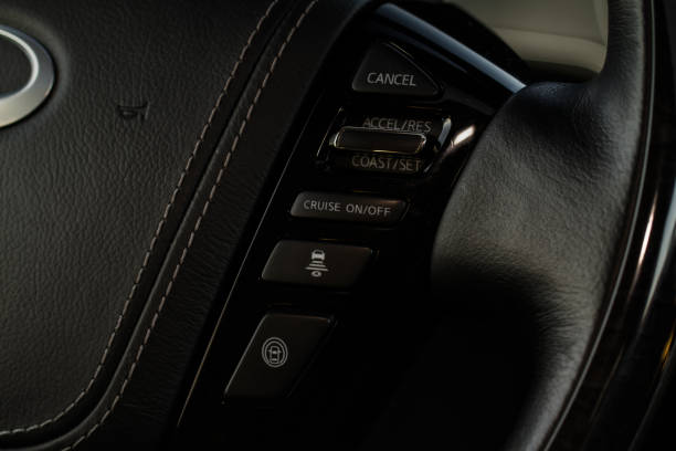 istock Cruise control switch closeup. Adaptive cruise control leaver. Cruise control on steering wheel. 1459545931