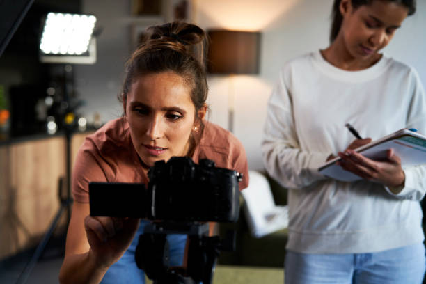 istock Two female women checking records on the camera and making notes 1459546064