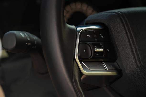istock Volume and audio control buttons on the steering wheel. Car audio controls 1459546139