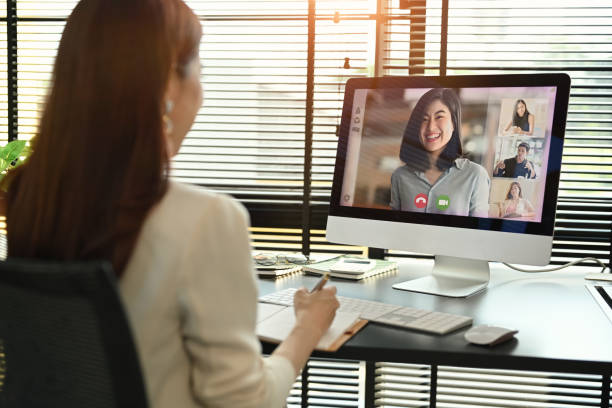 istock Millennial female manager communicating by video conference on computer. Distant webinar, online negotiations concept. 1459546676