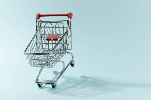 istock Iron small trolley from supermarket cyan background 1459547326